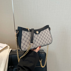 レトロな女性バッグの新しい質感フランスの腋の下バッグはシンプルでファッション的で洗練された贅沢な古い花のショルダーバッグです