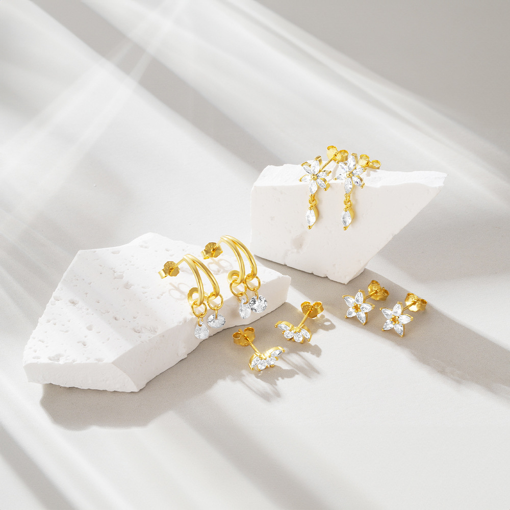 Pendientes de lujo ligero transfronterizo s925 ins de plata metal geométrico viento ojo de caballo flor gota de agua circón todo fósforo pendientes