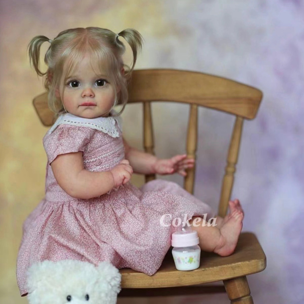 Cokela 58cm 3D simulación de alto color bebé renacido muñeca Maggi suministro transfronterizo entrega de una sola pieza