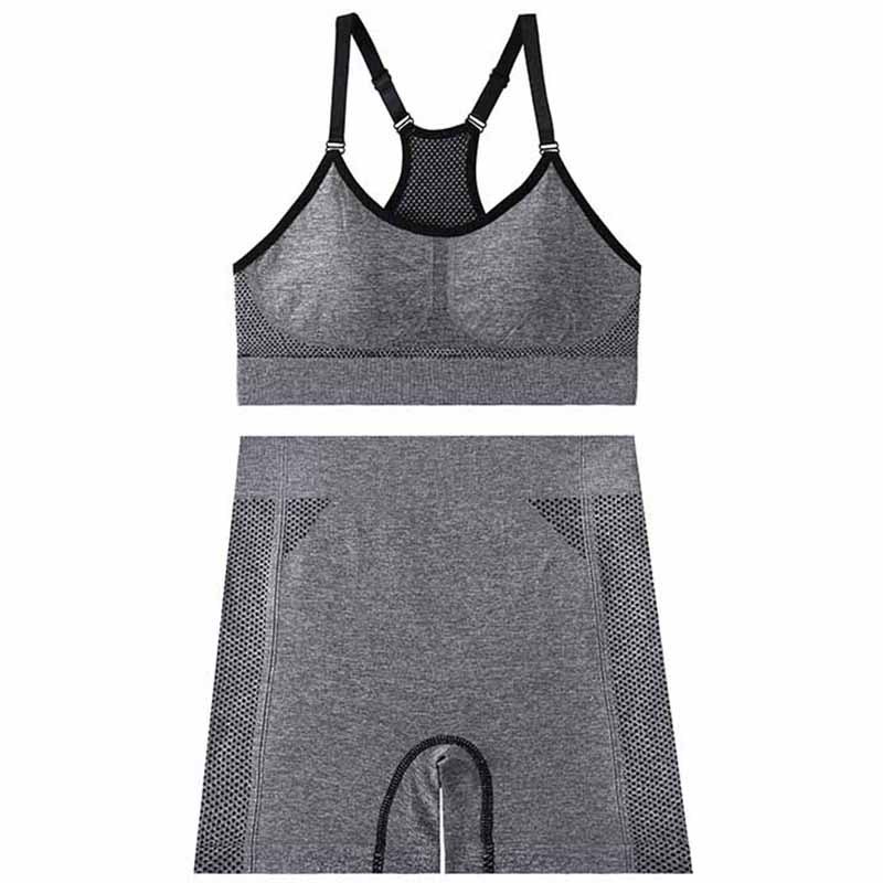 Nuevo traje de yoga sin costuras transfronterizo de color sólido en forma de trabajo diseño hueco sexy moda traje deportivo pantalones cortos