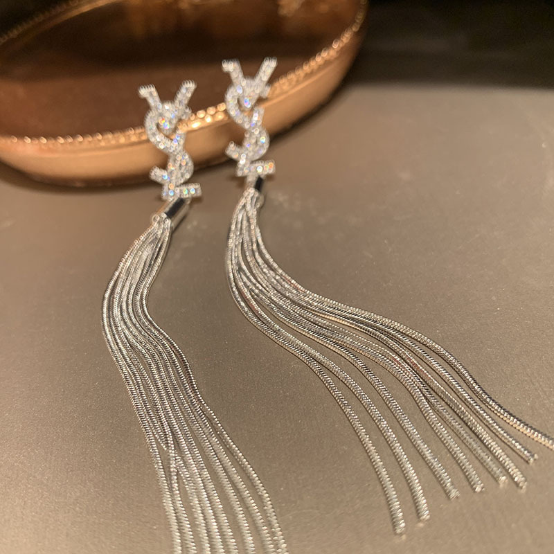 Earrings with letters with tassels