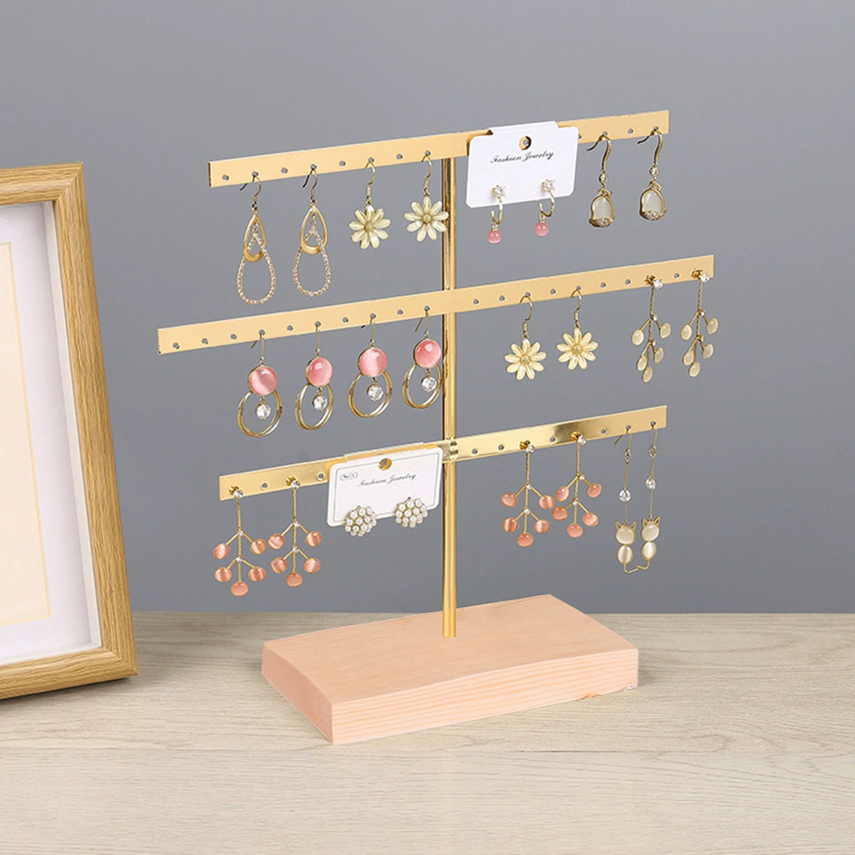 Earrings, golden stand, storage system