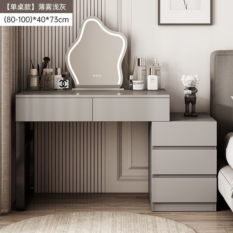 Wardrobe de madera maciza de tabla de roca dormitorio moderno simple pequeño tipo de lujo ligero de alta sensación armario de maquillaje en casa
