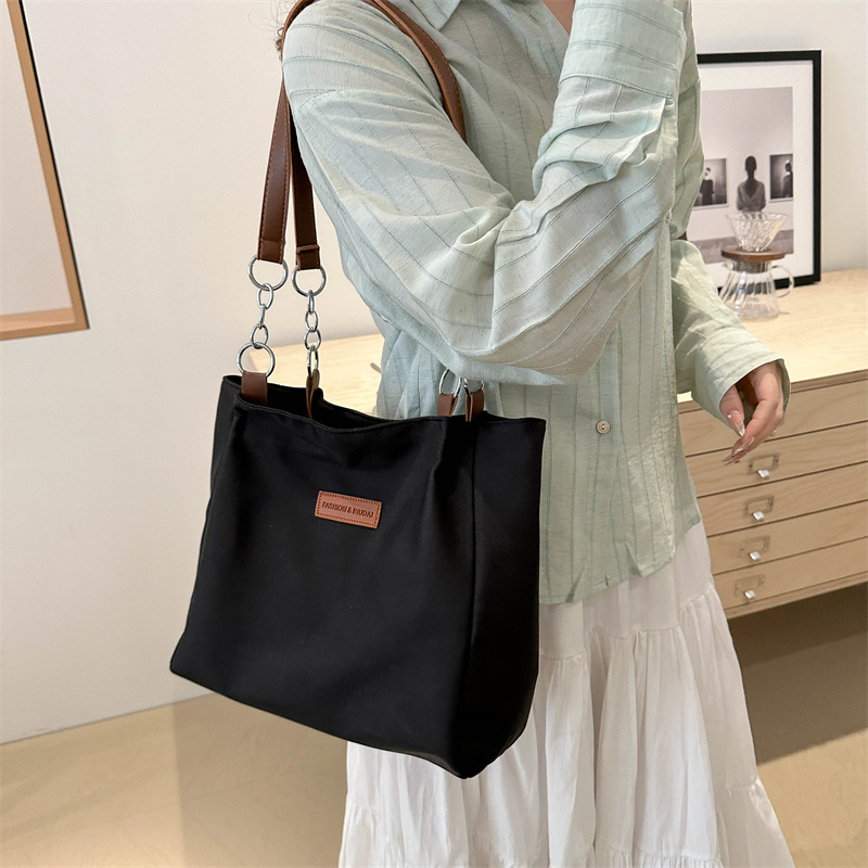 Casual bolsa de viaje de gran capacidad para mujeres 2024 nueva moda bolsa de lona universal bolso de hombro universal bolso simple