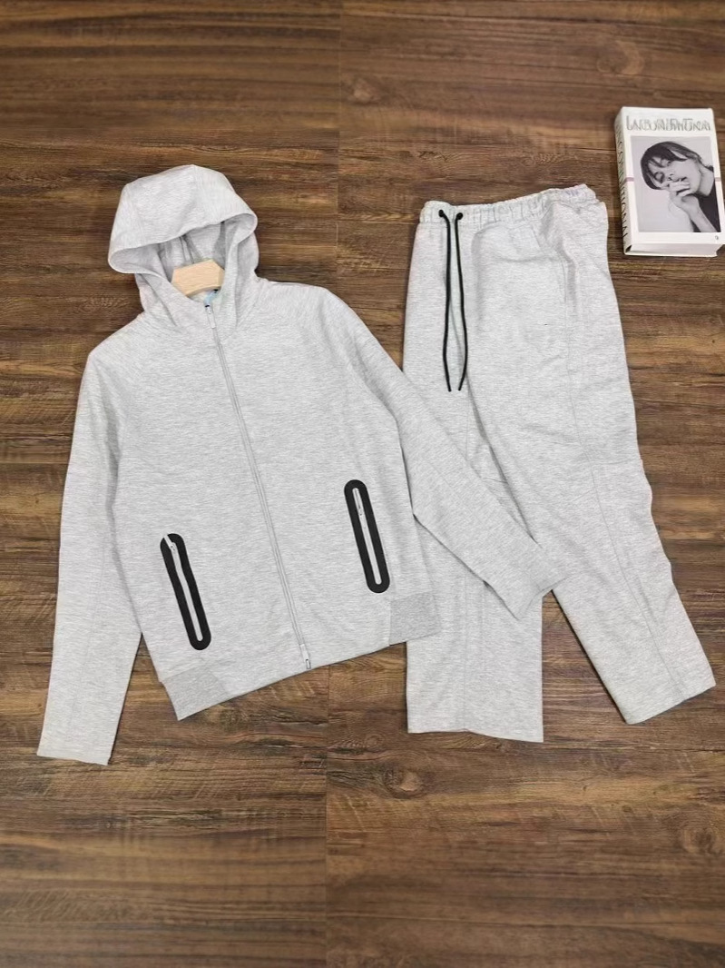 25 años primavera y otoño nuevo estilo casual deportes capa de aire chaqueta con capucha y pantalones trajes 454 y 461