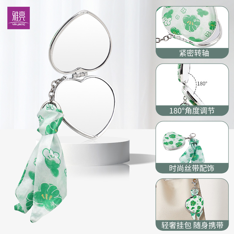 Espejo plegable con llavero en forma de corazón creativo Espejo pequeño portátil de doble cara de alto valor para la imagen Espejo de bolsa colgante de cinta personalizado