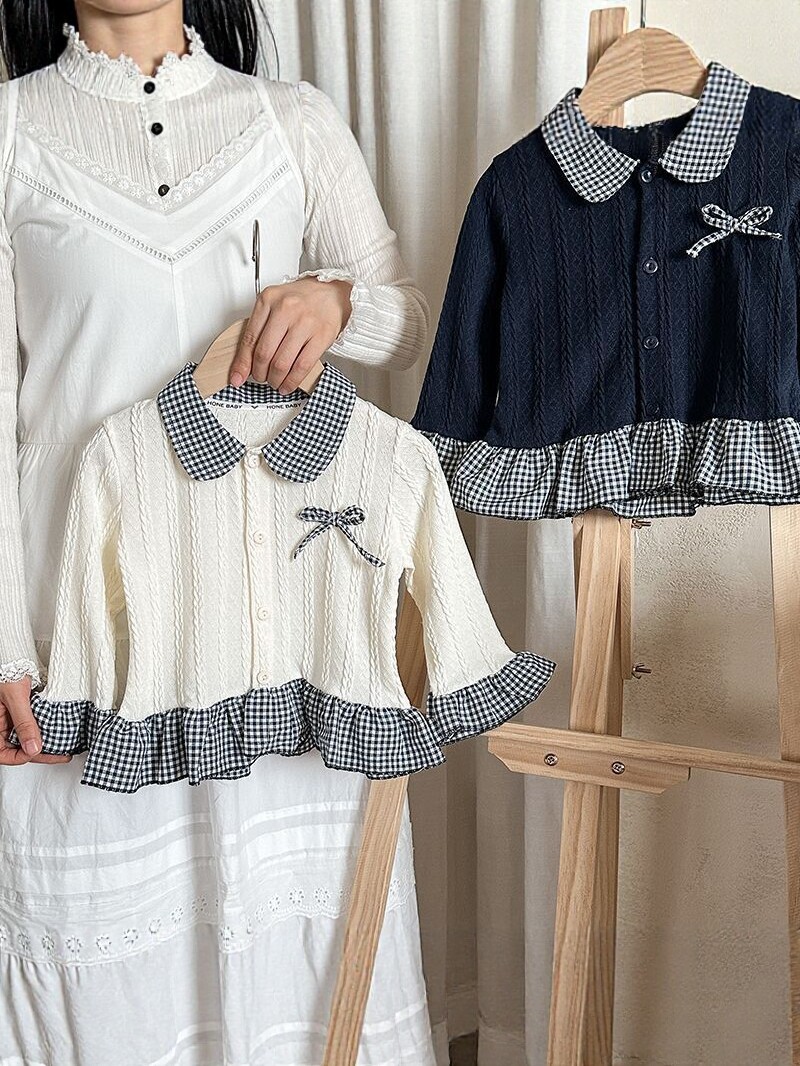 2026 primavera nueva camisa de cuello de muñeca de cuadrícula de mangas largas de encaje arco de camisa de estilo occidental para niños
