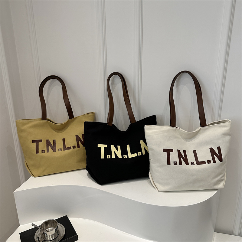 Bolsa de lona de gran capacidad para mujeres 2025, primavera y otoño, nueva literatura y moda, bolso de hombro, letras casuales, bolso de viaje