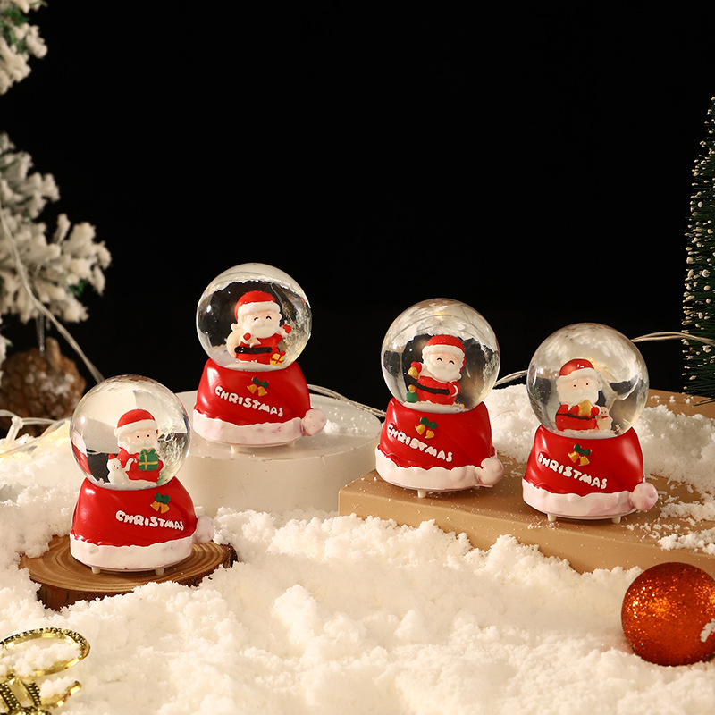 Una variedad de regalos de decoración de Navidad Navidad iluminante bola de cristal caja de música ventana diseño de velas lámparas de viento árbol de Navidad