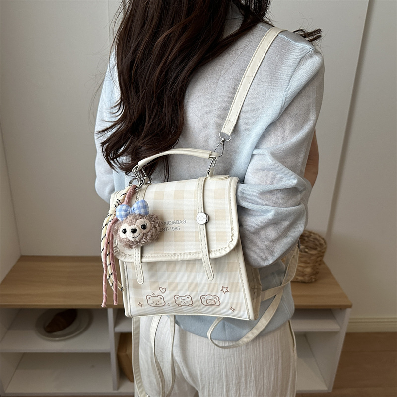Modelo coreano de moda retro estriado mochila de hombro mujer2026 textura alta temperamento versátil mochila casual