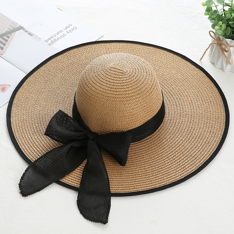 Women's Sweet Pastoral Solid Color Bowknot Big Eaves Straw Hat display picture 1