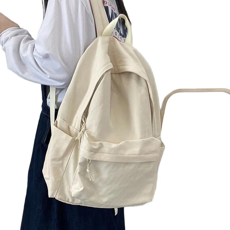 高校の学生の純色のカバンの女性ins森系の百合大学のキャンパスのシンプルな中学生のキャンバスのリュックサック|undefined