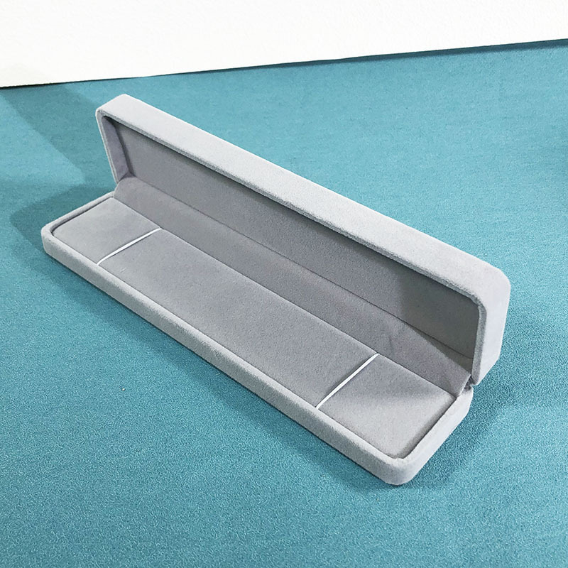 Light gray bracelet box; rounded velvet box