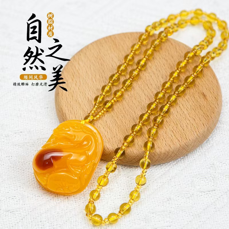 Live-streaming sales, trade show gifts, amber resin, second-generation Pixiu pendant for the elderly, chicken oil yellow sweater chain, wholesale from the manufacturer