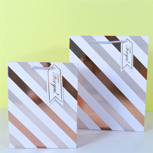 Cross-border special supply of hot stamping wavy pattern white card gift portable paper bag round ball five-pointed star shopping bag diagonal pattern