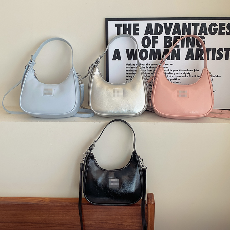 Bolsos de mujer al por mayor, nueva tendencia, bolsos de hombro de moda de alta gama, color sólido, dulce y fresco, bolso de bola de masa de mensajero con estampado brillante