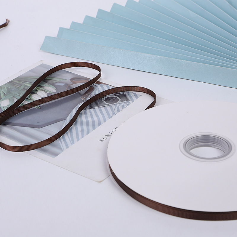 Suministro directo de fábrica cinta roscada cinta marrón caja de regalo embalaje bolso cinta accesorios de ropa cinta al por mayor