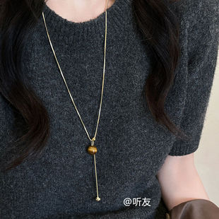 Design sense tiger eye stone spring and summer long sweater chain 2025 new temperament light luxury high-end necklace women's accessories