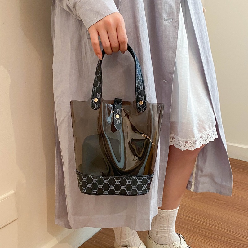 Bolsa de cubo transparente de moda de empalme de primavera y verano de 2026 nueva impresión de contraste de color personalidad bolso de hombro de textura mochila de moda
