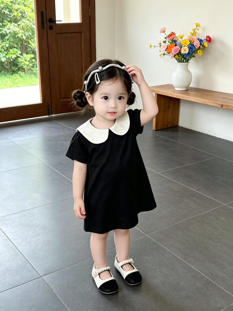 Bebé de verano vestido de estilo Hepburn bebé negro y blanco contraste muñeca cuello de manga corta A vestido de moda ropa infantil