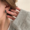 Small sophisticated fashionable black earrings, light luxury style, 2024 years