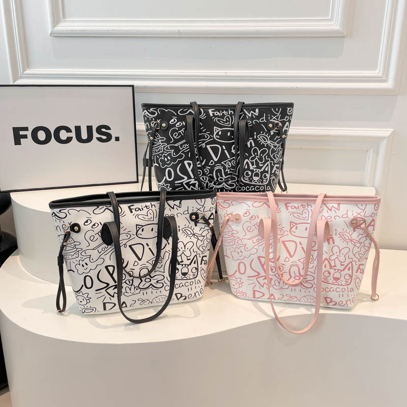 Nicho de diseño de graffiti bolso para mujeres 2025, nuevo bolso de hombro de mano casual, bolso de brazo de viaje de gran capacidad