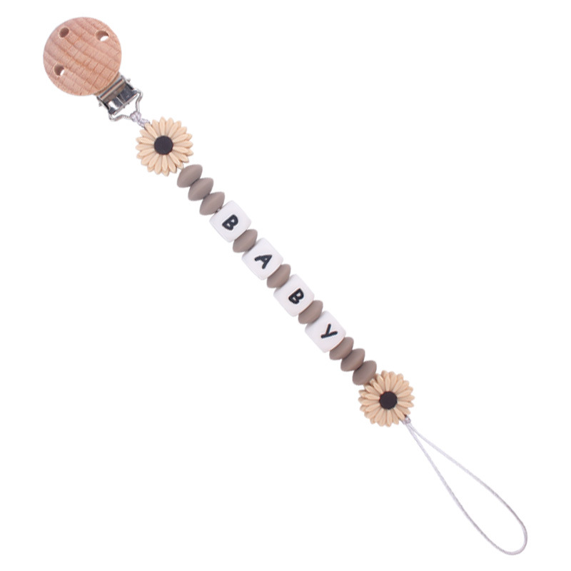 Nuevo bebé suministros de dibujos animados margarita teether creativo bebé DIY mordedura molar pezón cadena anti-gota cadena