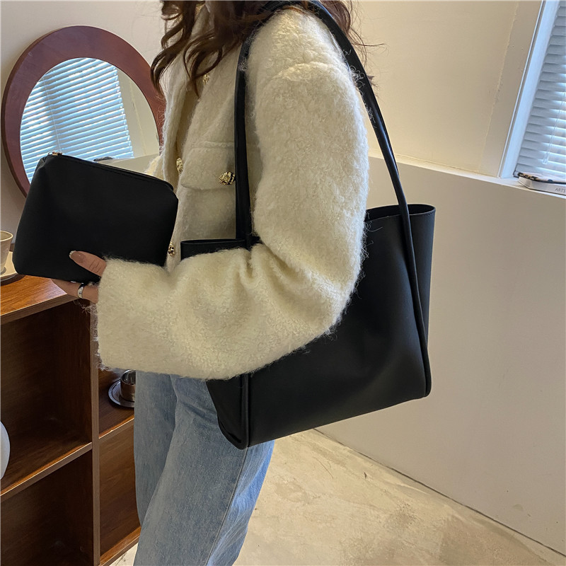 Bolso de color sólido coreano para niños 2023 nuevo bolso de mujer simple bolso de mano gran capacidad bolso de hombro de moda de primavera