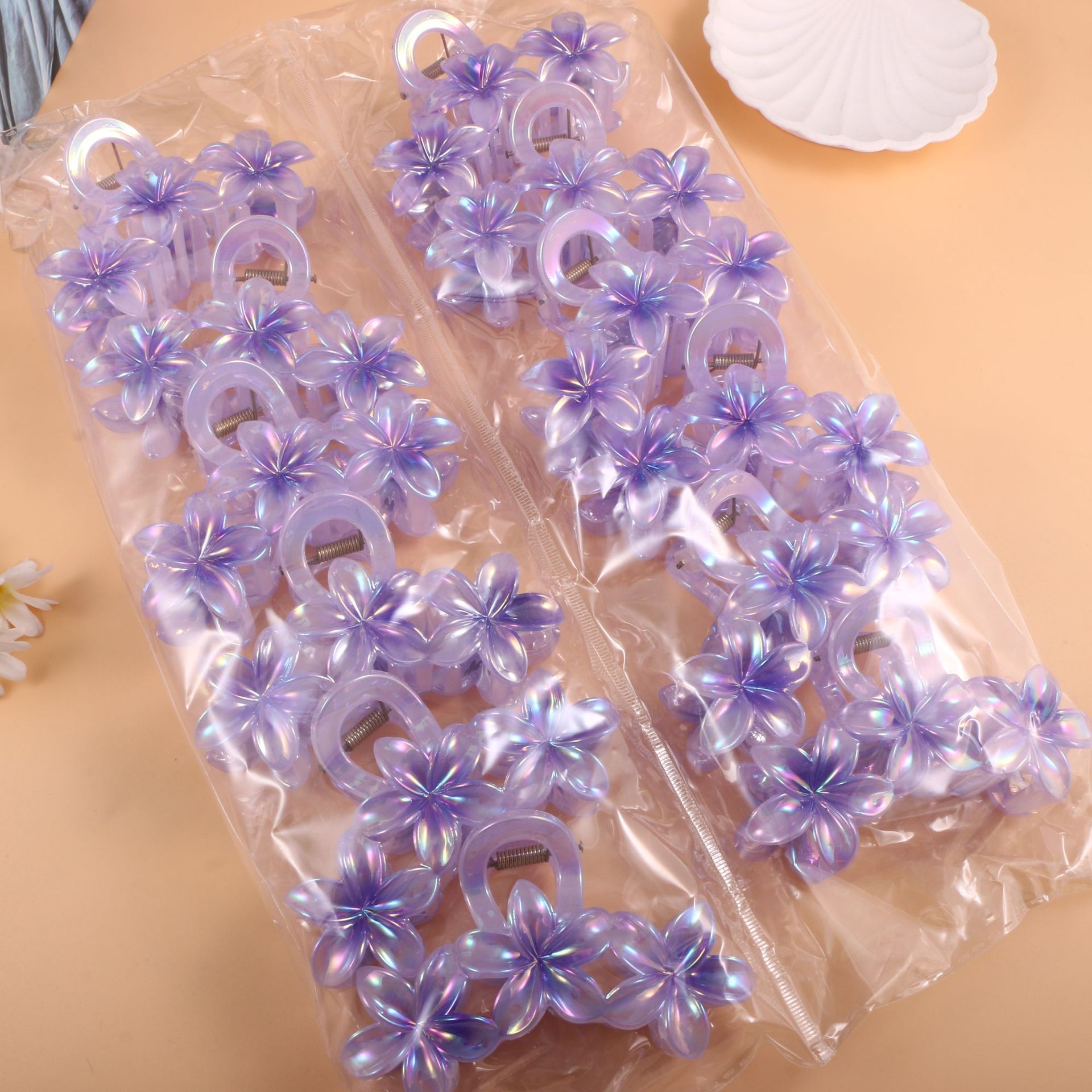 Nuevo color frangipani acrílico pinza para el cabello flor pinza de agarre de alta calidad elegante accesorio para el cabello de mujer pinza de tiburón de agarre lateral