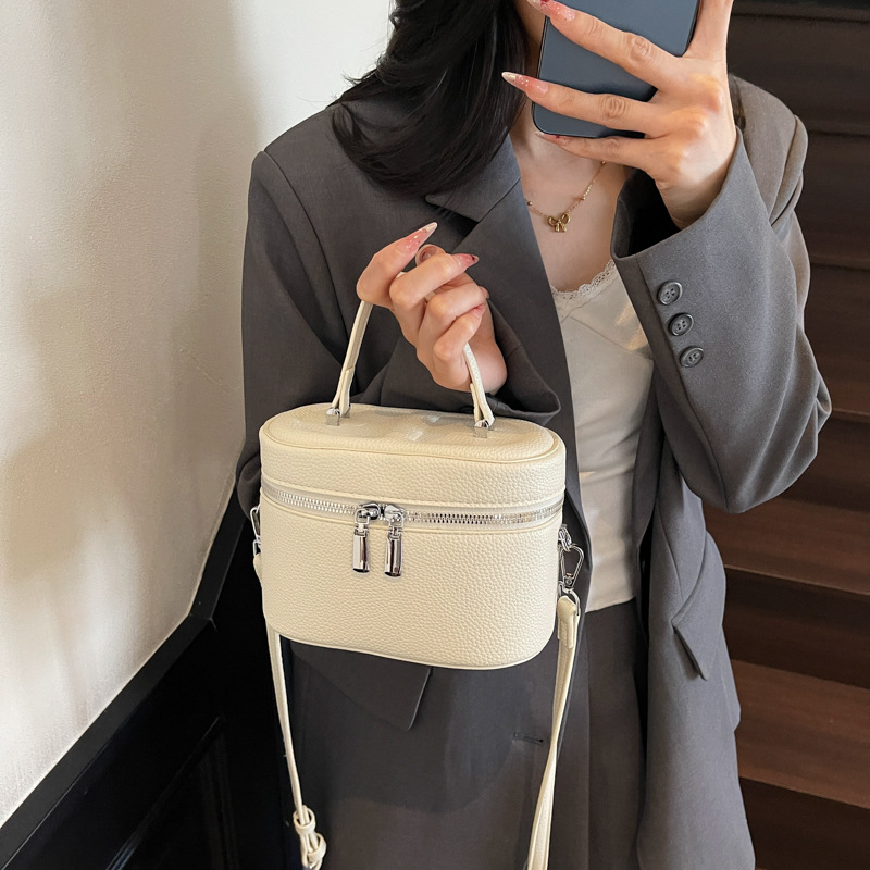 Bolso de cubo popular de este año 2025 verano nuevo bolso de hombro con patrón de lichi bolso de mensajero simple y versátil mujer