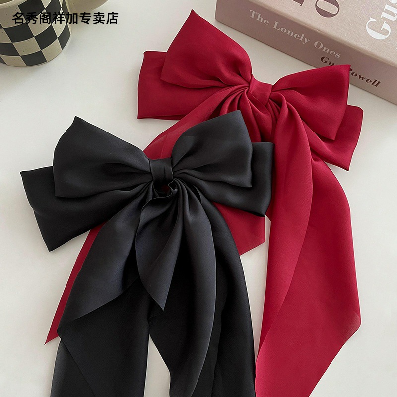 Versión coreana de la nueva horquilla de cinta con lazo simple y generosa clip de resorte de satén clip de cabello fijo retro red neta