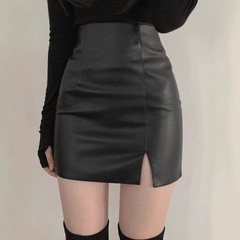 黒いオープンフォークの小さい皮のスカートのスカートの女性の秋の新型のタイツの高い腰の包みの尻はやせている一歩のスカートのpu皮のショートスカートを現します。
