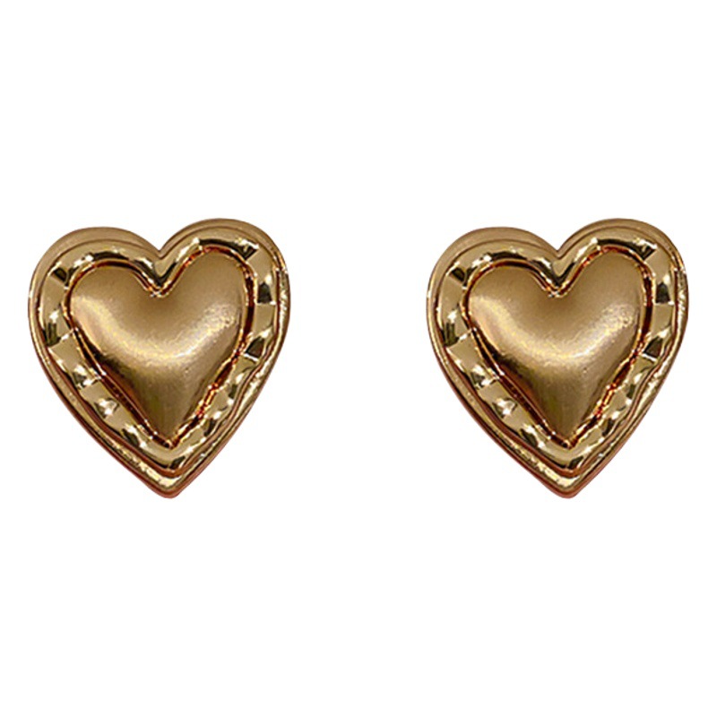 Pendientes de metal con aguja de plata Pendientes simples de alta calidad Pendientes de nicho de personalidad de lujo ligero de todo fósforo de moda Yiwu al por mayor