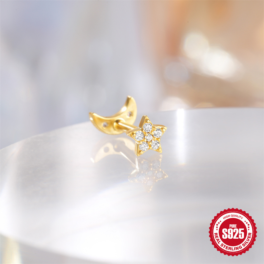 Moda europea y americana todo fósforo s925 plata esterlina tres diamantes borlas de ojo de caballo de doble cara uso de pernos en espiral de cartílago