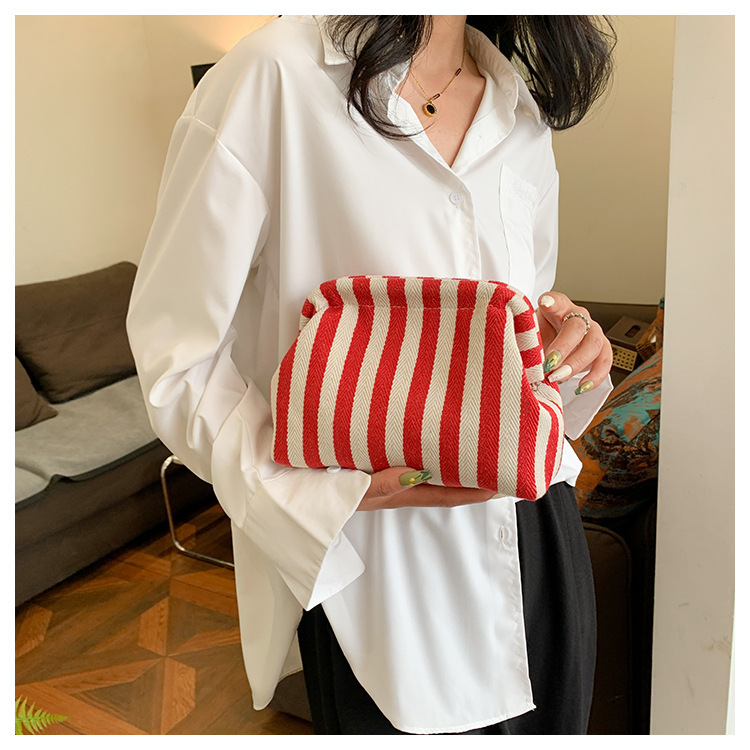 New cross-border fashion color-blocking striped cosmetic bag, women's loose change mobile phone storage bag, trendy and niche cloud clutch undefined