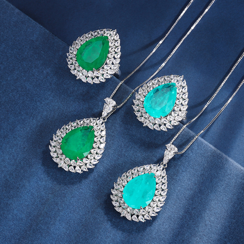 Zhuang Sheng joyería cobre inferior oro plateado traje europeo y americano simulación color tesoro gota de agua diamante anillo colgante 13*18