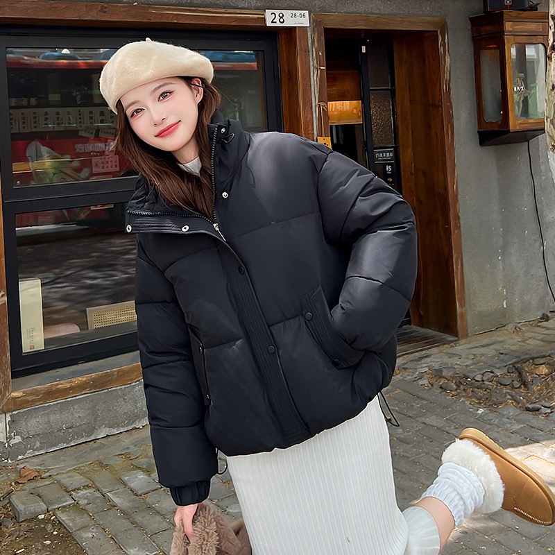 Invierno transfronterizo coreano 2025 nuevo abrigo de algodón de pluma de estilo universitario corto de mujer chaqueta de algodón de hombre pequeño Europa y América lote