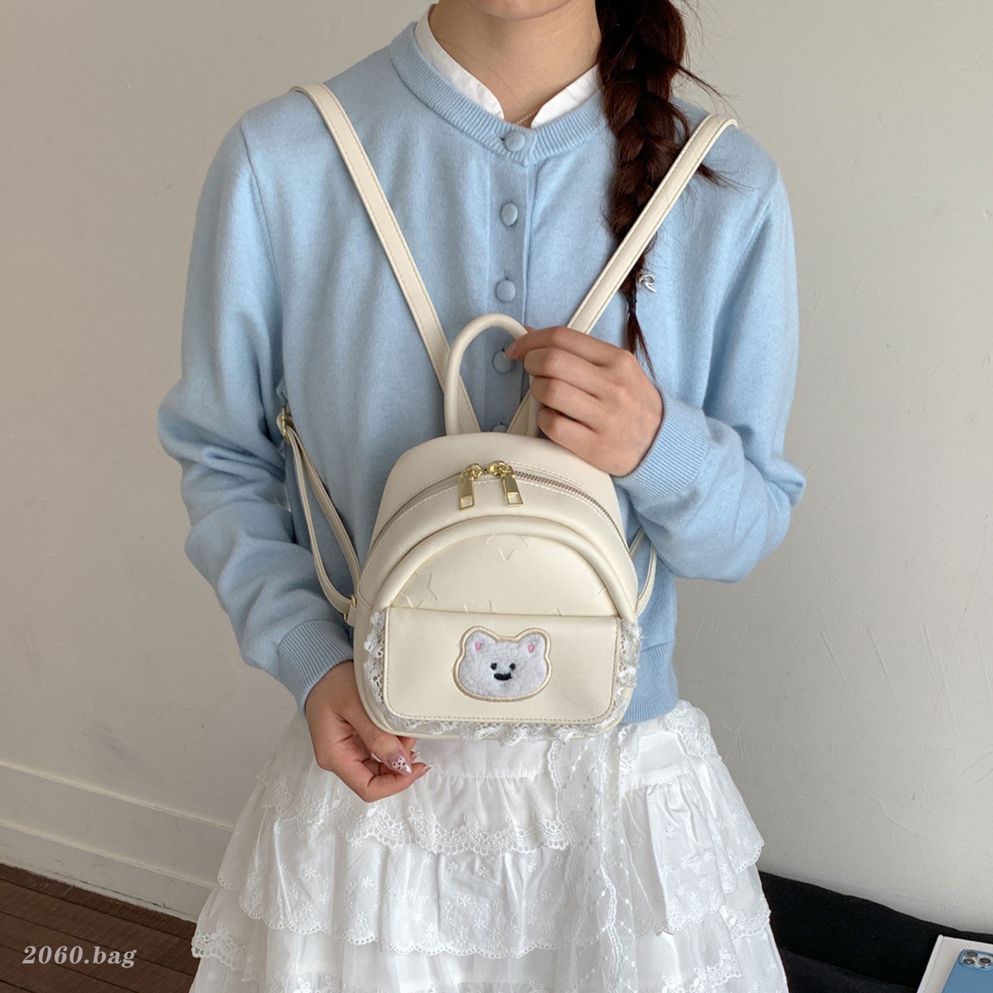 Mujeres nuevas estilos de dibujos animados simples estudiantes 2026 verano universal mochila ligera oso mochila encantador viaje coreano