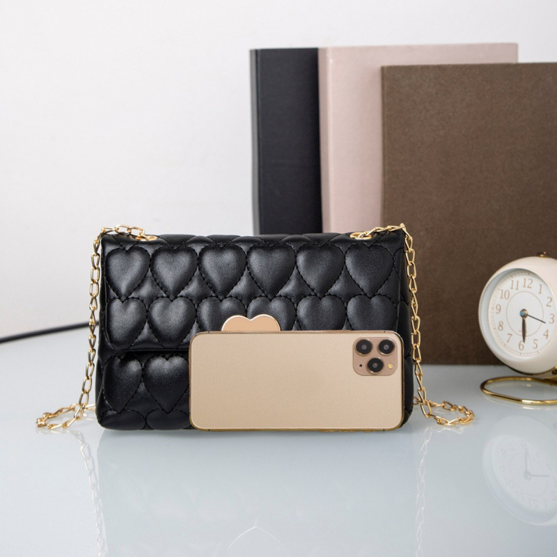 Bolsa de hombro de cerradura de corazón de melocotón comercio exterior al por mayor 2025 primavera y verano nuevo bolso multifuncional de mujer, bolso de mujer interior