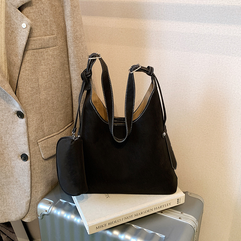 Bolso relajado coreano de cuero suave retrógrado para mujeres bolso de cubo de gran capacidad 2025 nuevo hombro bajo la braza bolso mochila