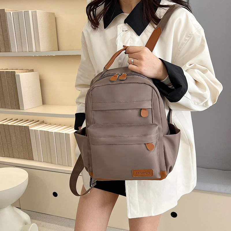 2025 primavera nueva mochila simple de color sólido mochila de estudiantes de escuela primaria mochila de viaje al aire libre