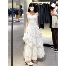 莜曼娜法式白色蕾丝吊带裙女夏季2025新款海边度假风不规则中长裙