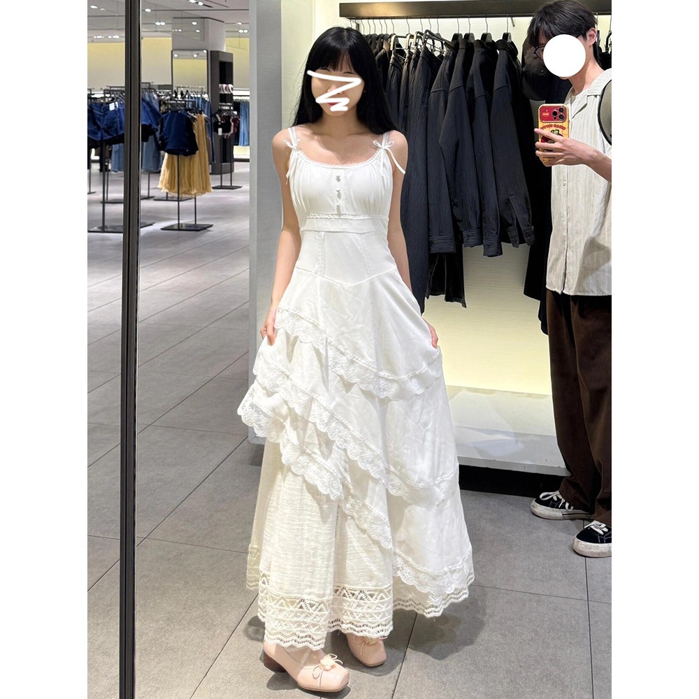 莜曼娜法式白色蕾丝吊带裙女夏季2025新款海边度假风不规则中长裙