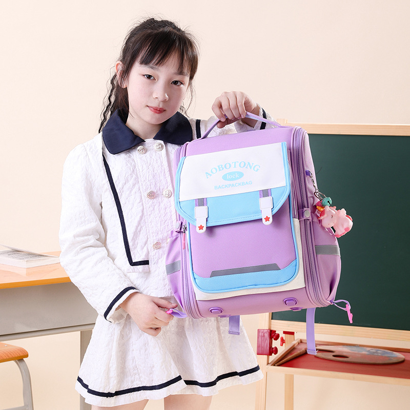 Natural Fish 2025 nuevas mochilas escolares para niños y estudiantes de grado 1-3 versión coreana de gran capacidad para reducir la carga y proteger la columna