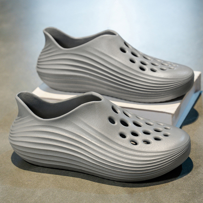 Zapatos con agujeros de coco para hombres nuevo estilo verano al aire libre vadeo Baotou bolso con tacón sandalias antideslizantes EVA pisando la mierda sandalias y zapatillas