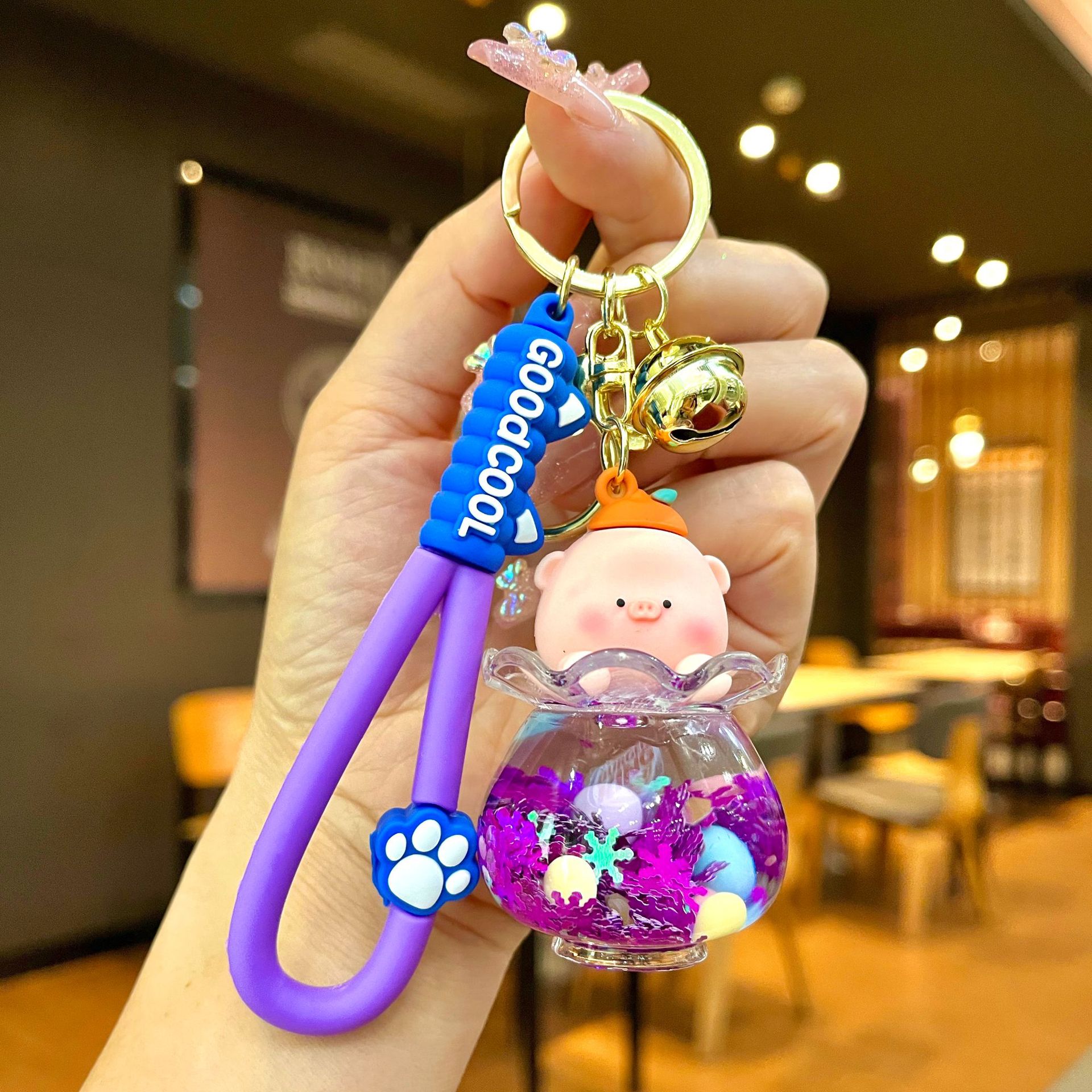 Aceite de gato garra arenas movedizas llavero lindo dibujos animados cadena colgante captura muñeca máquina agarrar pequeño regalo al por mayor