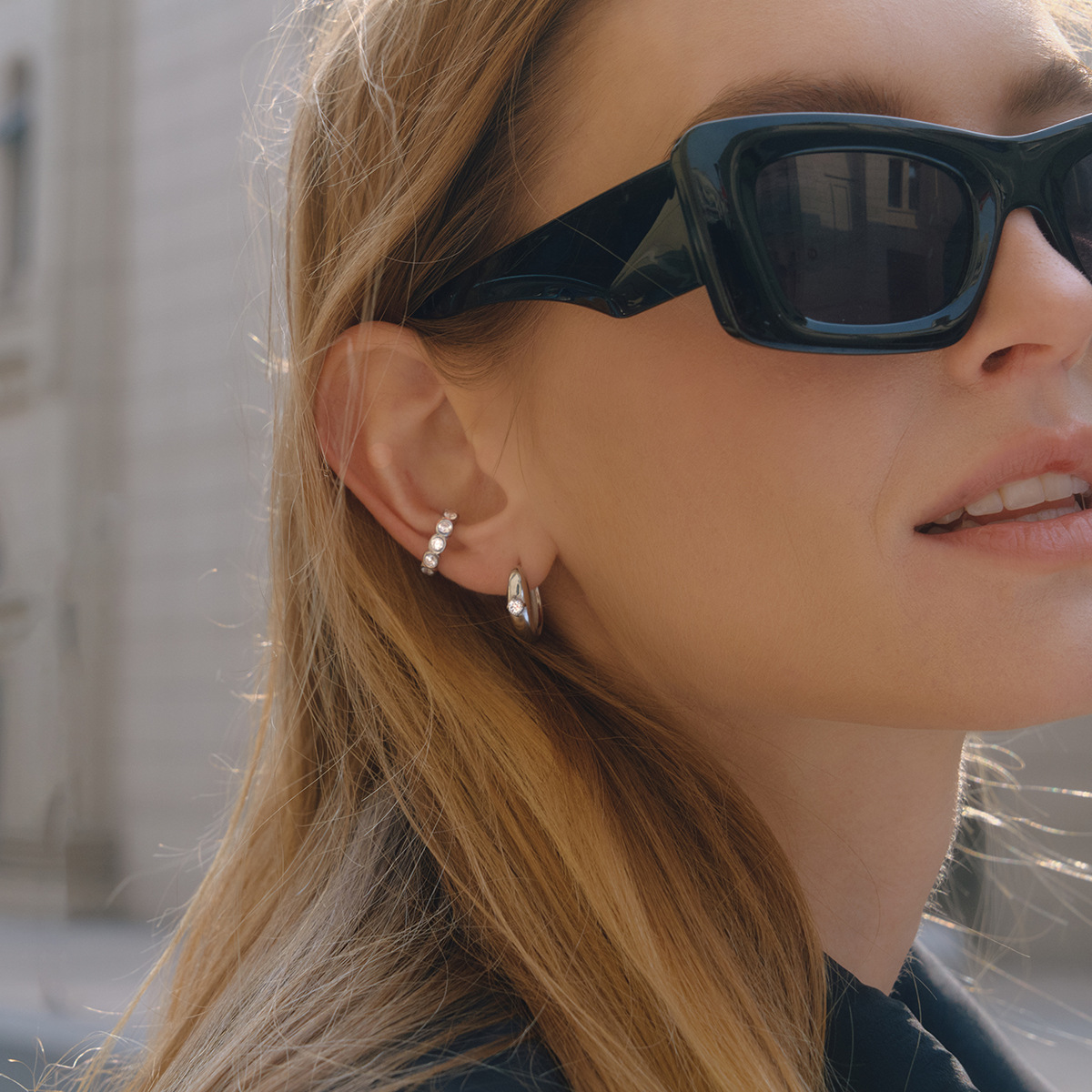 Wanxing europa y americana pendientes de zircon blanco ligero lujo alto sentido de joyería transfronteriza nicho diseño pendientes de acero inoxidable