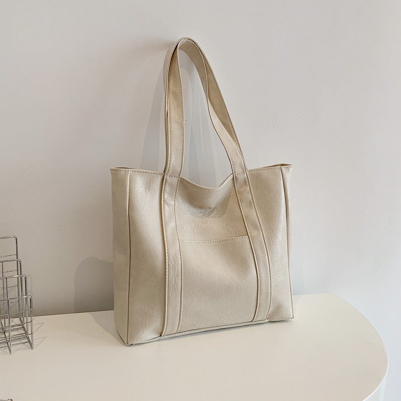 Bolsa de gran capacidad para mujeres 2024 nuevo estilo americano bolsas de compras de mano textura bolsas de hombro pu bolsas casuales simples