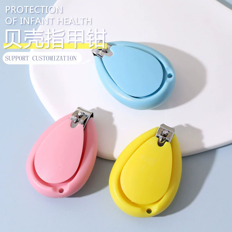 Производитель поставляет детские кусачки для ногтей, практичные кусачки в форме ракушки для младенцев и детей младшего возраста, безопасные кусачки для ногтей.