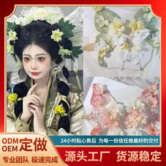 漢服の頭飾りの古風なアクセサリーの絹の花はかんざしを挟んで、あそびをします。